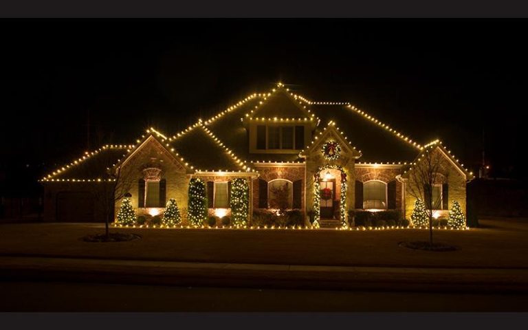 House with christmas holiday lighting at night